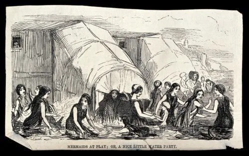 Women bathing in the sea near their bathing machines