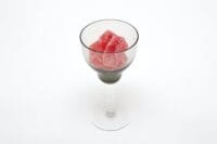 red gummies in clear wine glass