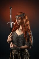 young woman in chainmail armor with sword