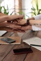 photo of people near wooden table