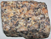 a piece of granite stone with flecks of white, pink and black.